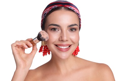 Photo of Beautiful woman applying makeup with brush on white background