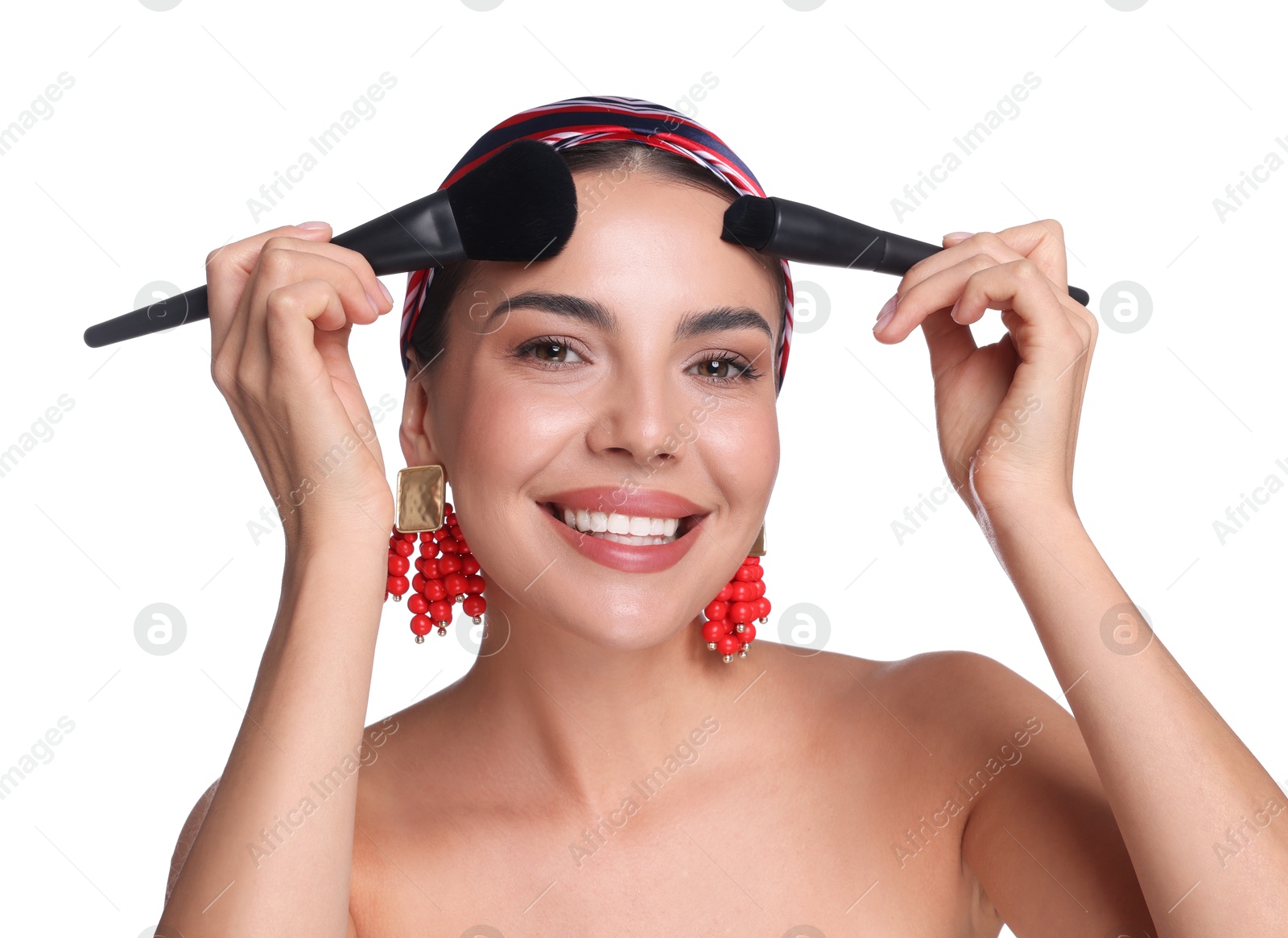 Photo of Beautiful woman with makeup brushes on white background