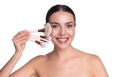 Photo of Beautiful woman with makeup brushes on white background