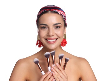Photo of Beautiful woman with makeup brushes on white background