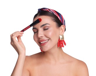 Photo of Beautiful woman applying makeup with brush on white background