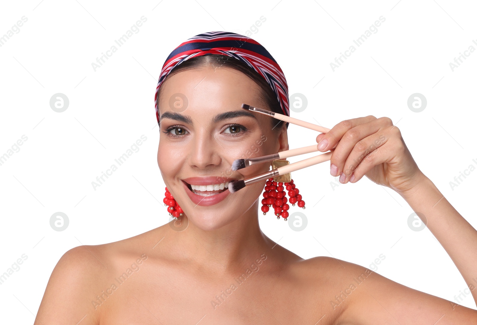Beautiful woman with makeup brushes on white background Photo of Beautiful woman with makeup brushes on white background