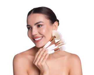 Photo of Beautiful woman with makeup brushes on white background