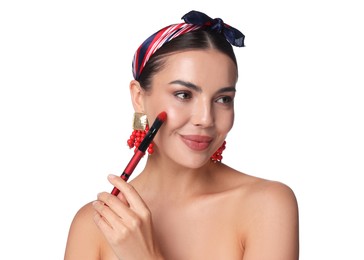 Photo of Beautiful woman applying makeup with brush on white background