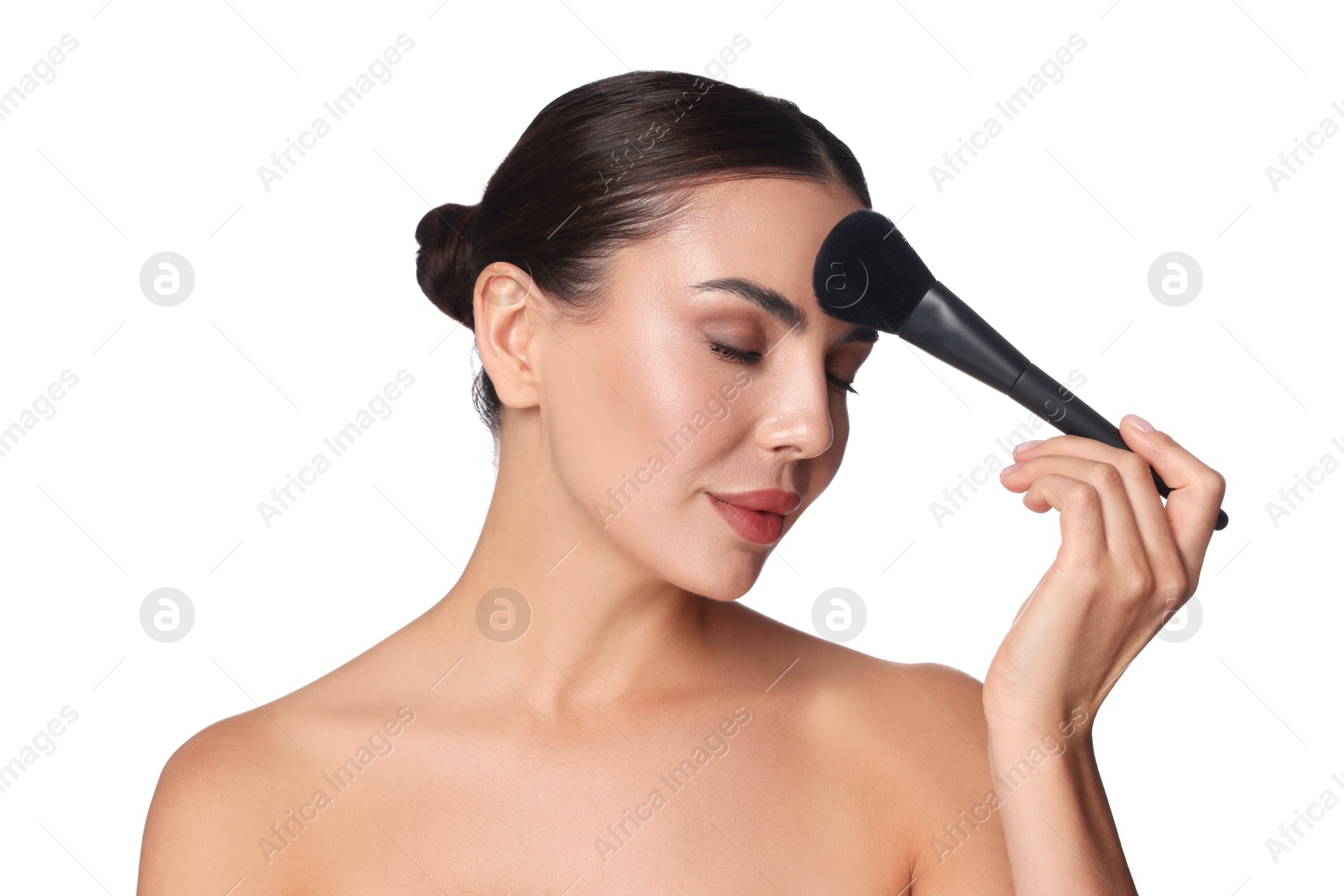 Photo of Beautiful woman applying makeup with brush on white background