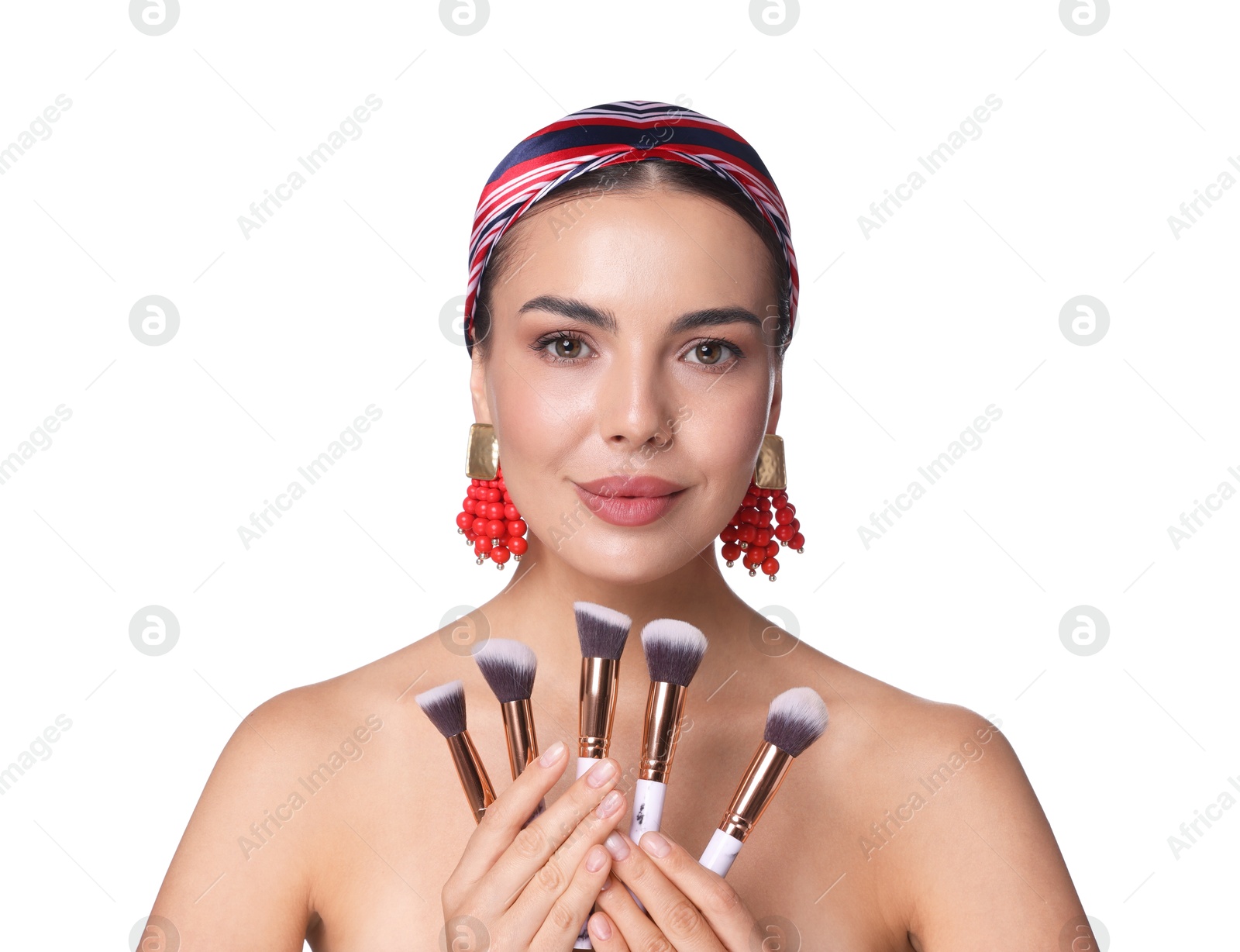Photo of Beautiful woman with makeup brushes on white background