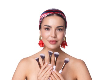 Photo of Beautiful woman with makeup brushes on white background