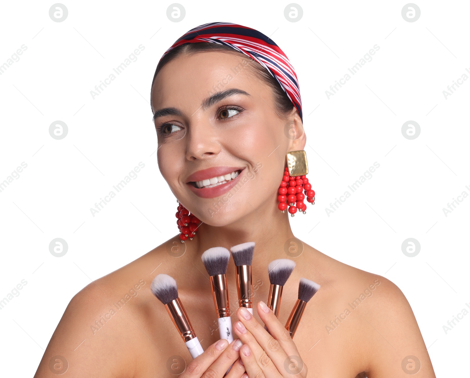Beautiful woman with makeup brushes on white background Photo of Beautiful woman with makeup brushes on white background