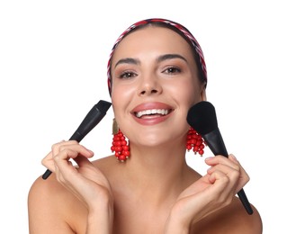 Photo of Beautiful woman with makeup brushes on white background