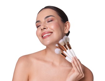 Photo of Beautiful woman with makeup brushes on white background