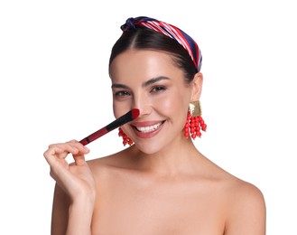 Photo of Beautiful woman applying makeup with brush on white background