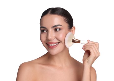 Photo of Beautiful woman applying makeup with brush on white background
