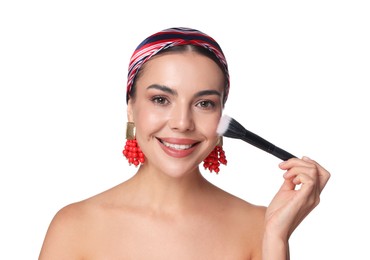 Photo of Beautiful woman applying makeup with brush on white background
