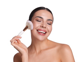 Photo of Beautiful woman applying makeup with brush on white background