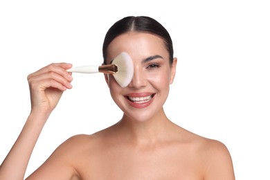 Photo of Beautiful woman with makeup brush on white background