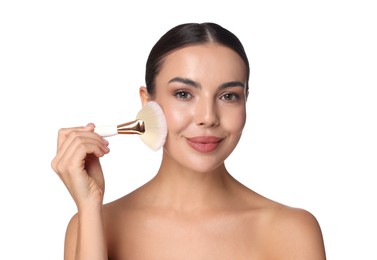Photo of Beautiful woman applying makeup with brush on white background