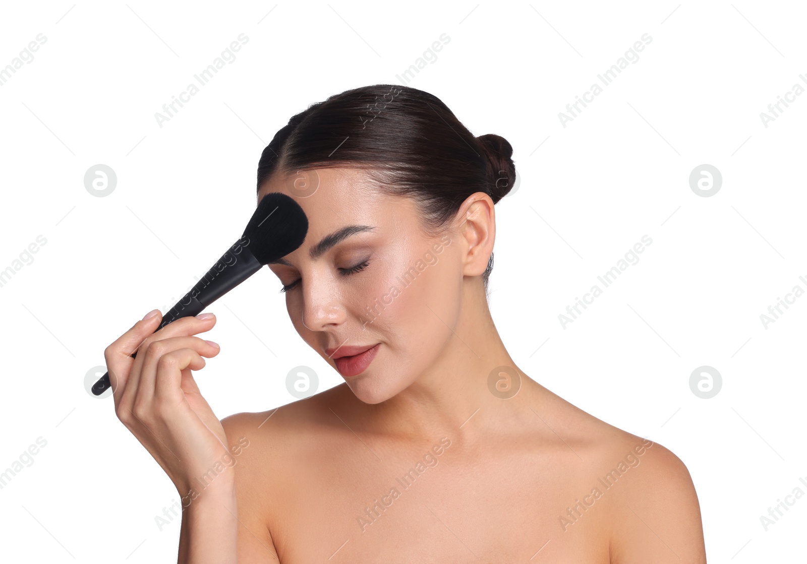 Photo of Beautiful woman applying makeup with brush on white background