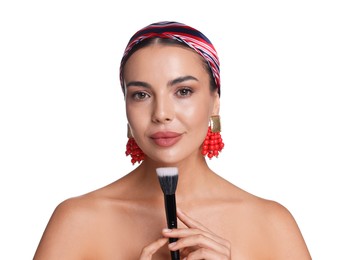 Photo of Beautiful woman with makeup brush on white background