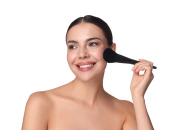 Photo of Beautiful woman applying makeup with brush on white background