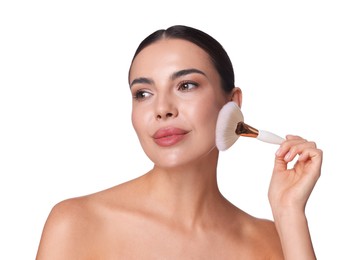 Photo of Beautiful woman applying makeup with brush on white background