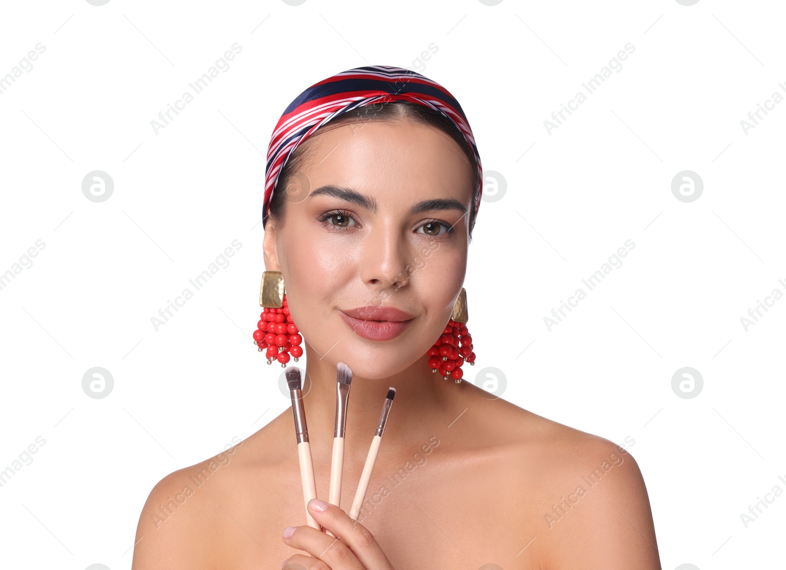 Photo of Beautiful woman with makeup brushes on white background