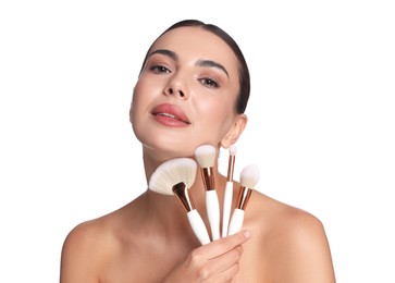 Photo of Beautiful woman with makeup brushes on white background