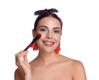 Photo of Beautiful woman applying makeup with brush on white background