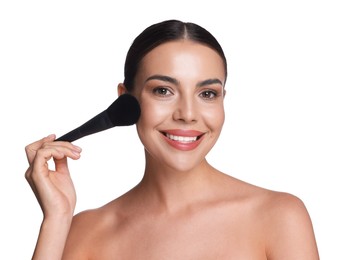 Photo of Beautiful woman applying makeup with brush on white background
