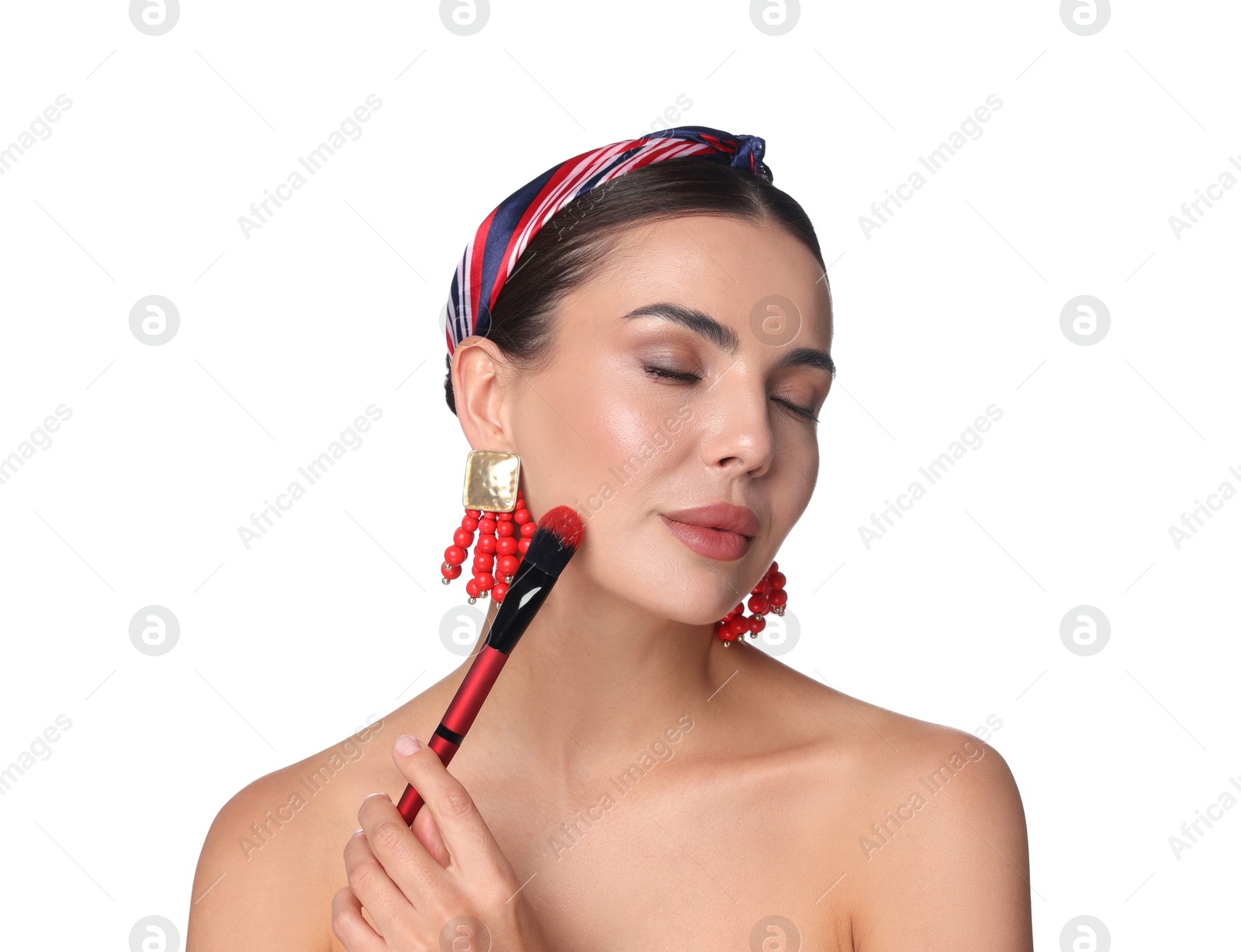 Beautiful woman applying makeup with brush on white background Photo of Beautiful woman applying makeup with brush on white background