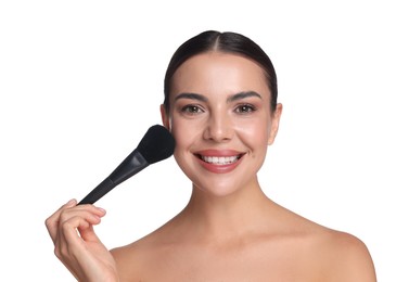 Photo of Beautiful woman applying makeup with brush on white background