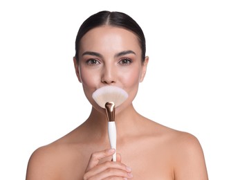 Photo of Beautiful woman with makeup brush on white background