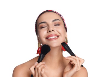 Photo of Beautiful woman with makeup brushes on white background