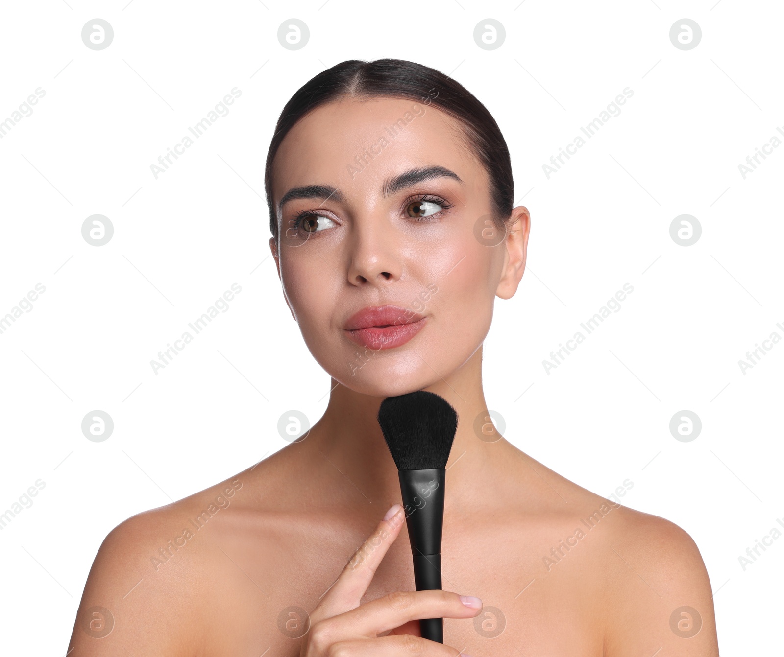 Beautiful woman applying makeup with brush on white background Photo of Beautiful woman applying makeup with brush on white background