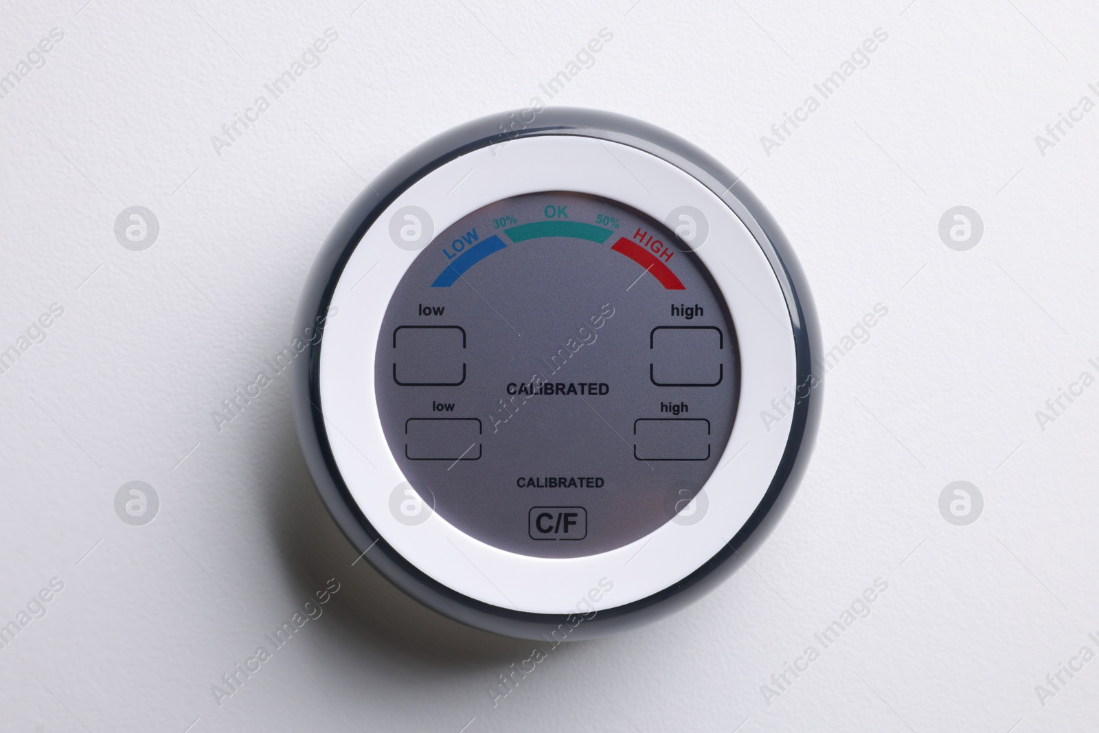 One hygrometer on white wall. Smart home system Photo of One hygrometer on white wall. Smart home system