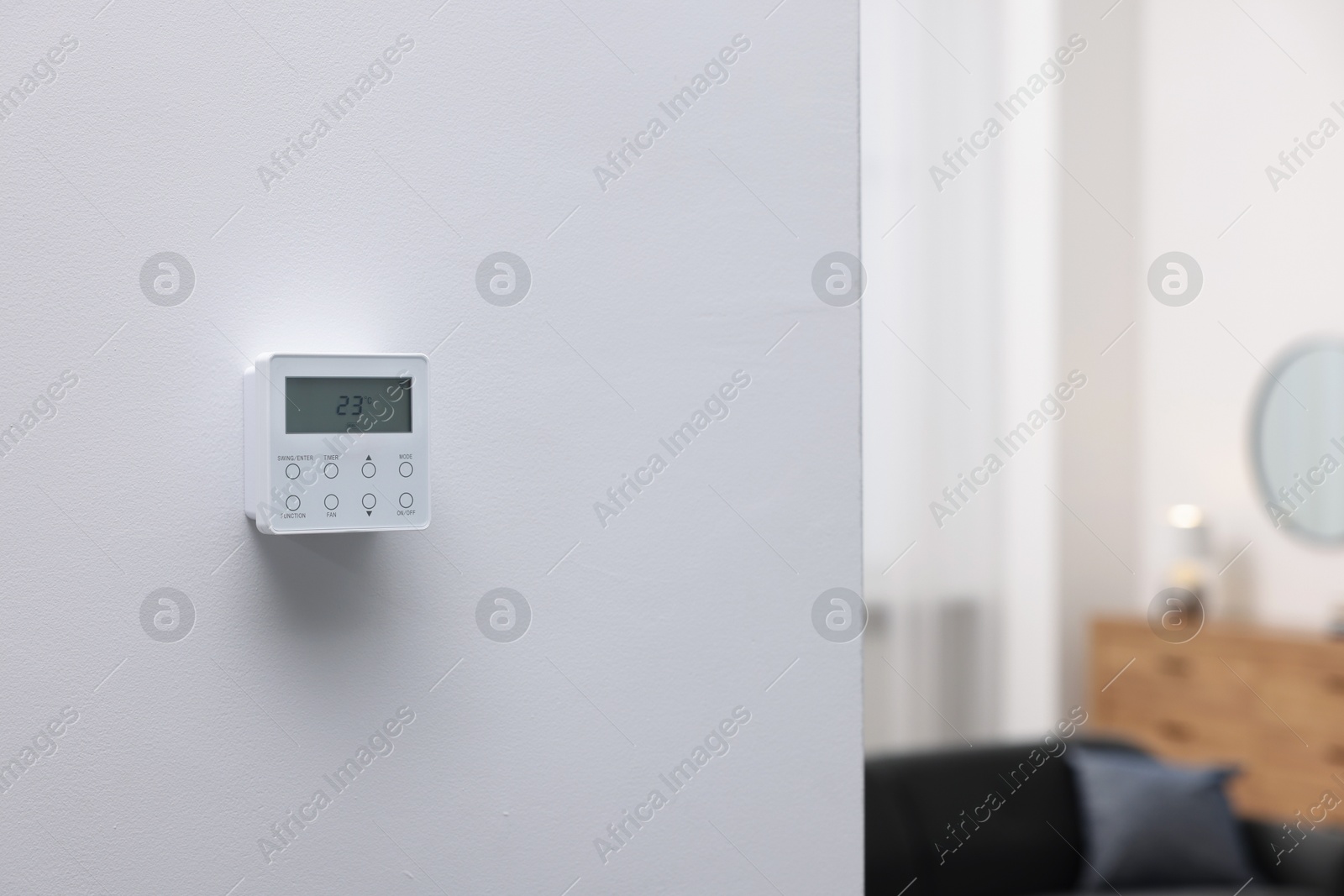 One thermostat on white wall indoors, space for text. Smart home system Photo of One thermostat on white wall indoors, space for text. Smart home system