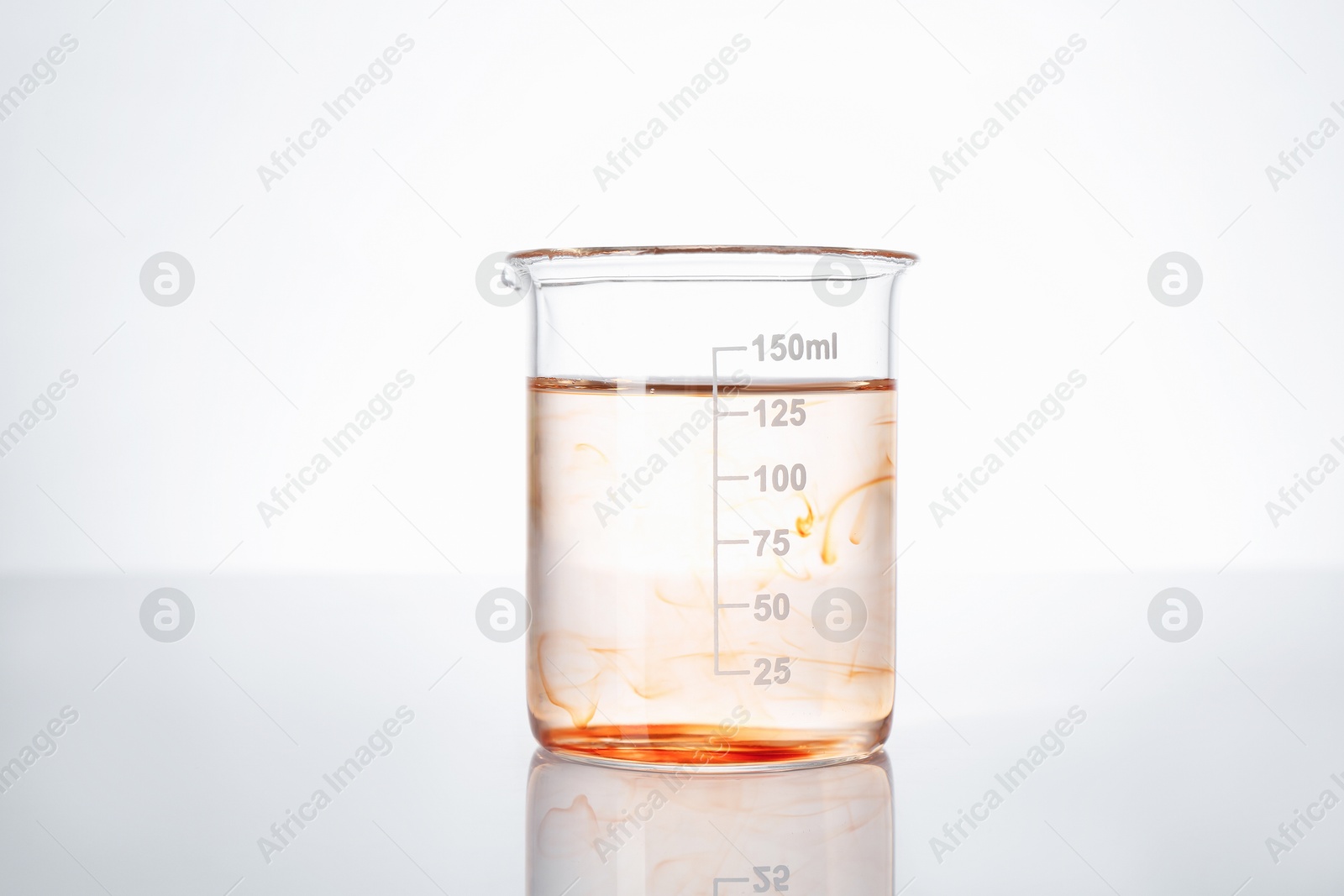 Glass beaker with dirty water on white background Photo of Glass beaker with dirty water on white background