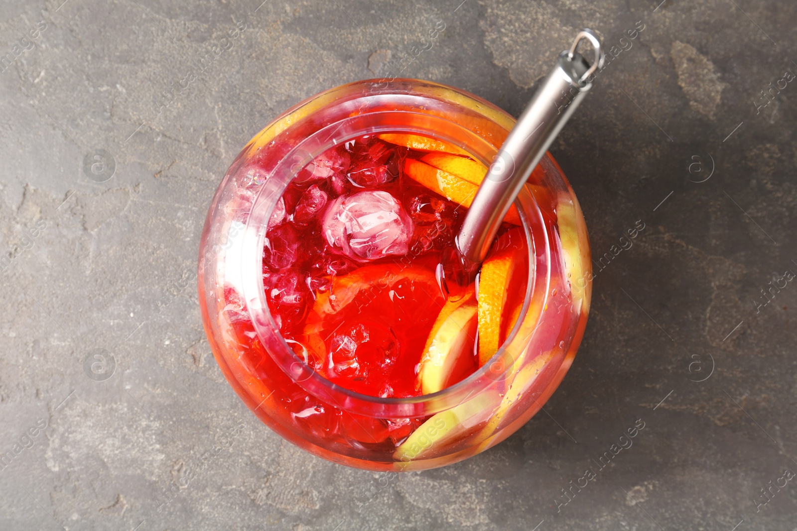 Fruity punch on grey table, top view. Refreshing drink Photo of Fruity punch on grey table, top view. Refreshing drink