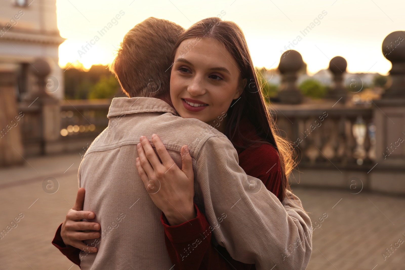 Photo of Goodbye. Lovely couple hugging on city street