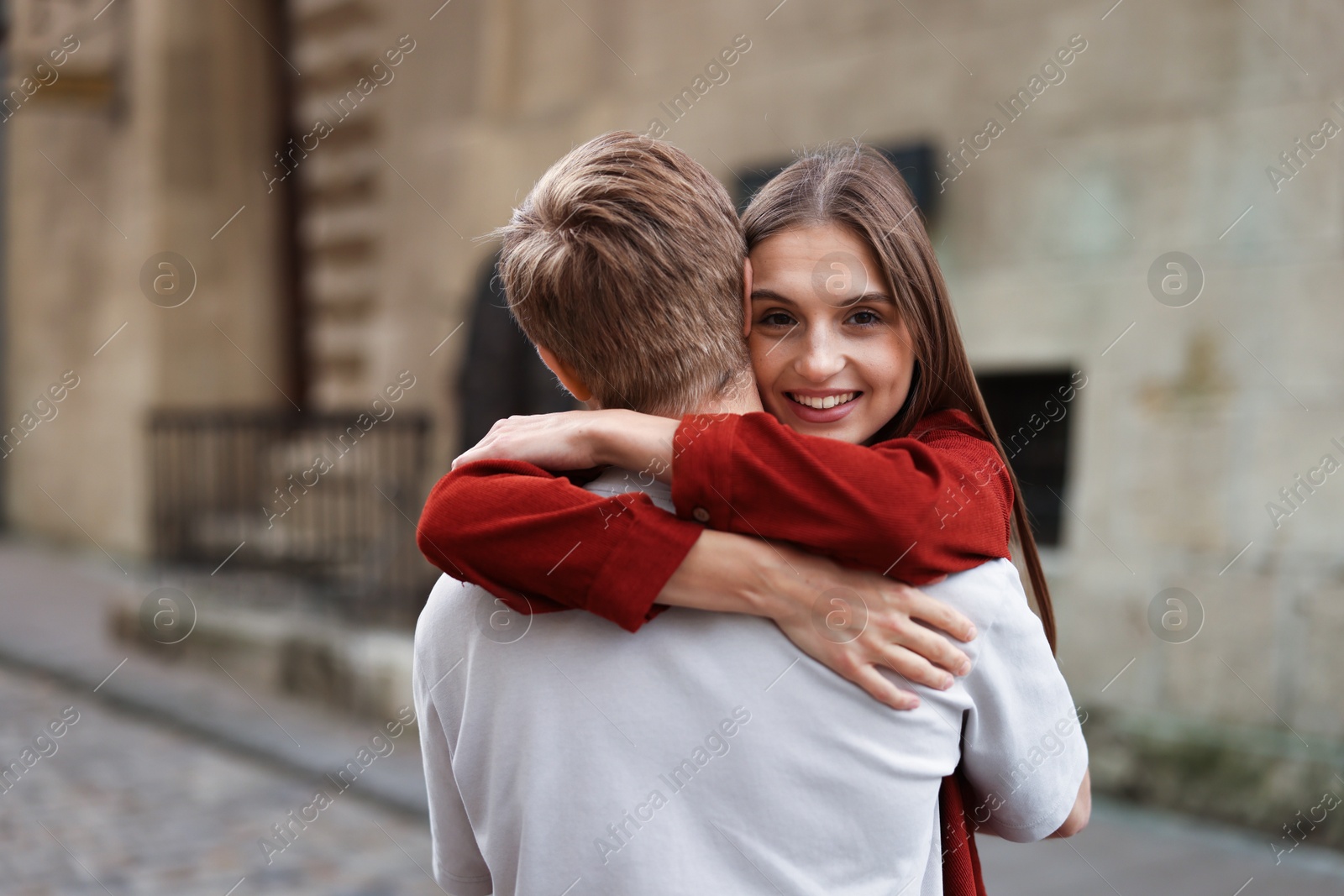 Photo of Goodbye. Lovely couple hugging on city street