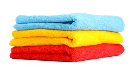 Photo of Stack of colorful terry towels isolated on white