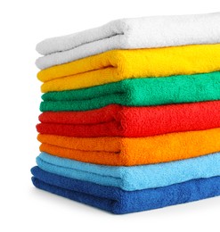Photo of Stack of colorful terry towels isolated on white