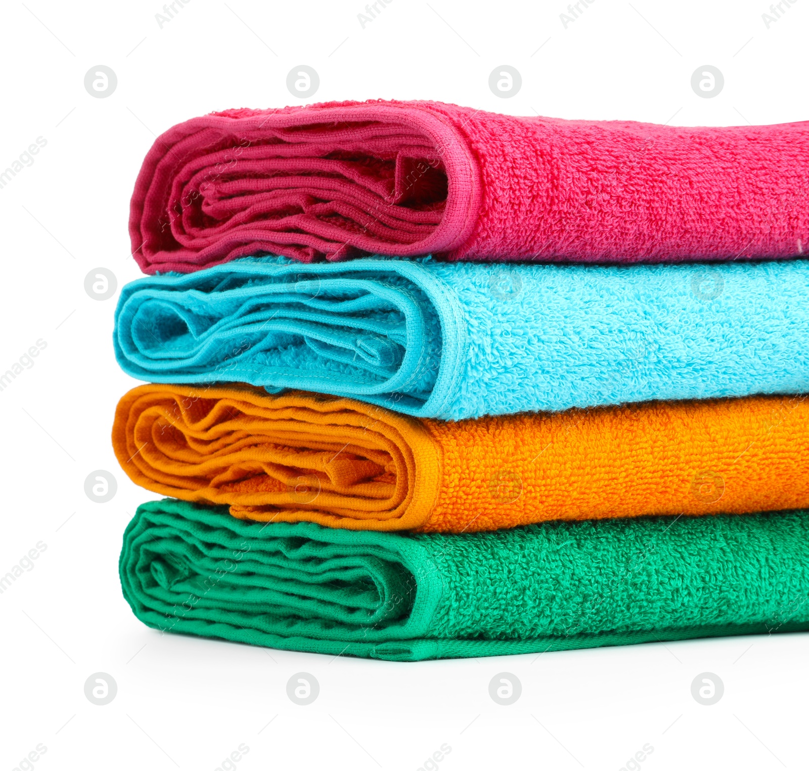 Photo of Stack of colorful terry towels isolated on white