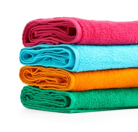 Photo of Stack of colorful terry towels isolated on white