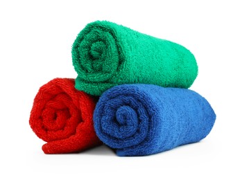 Photo of Colorful rolled terry towels isolated on white