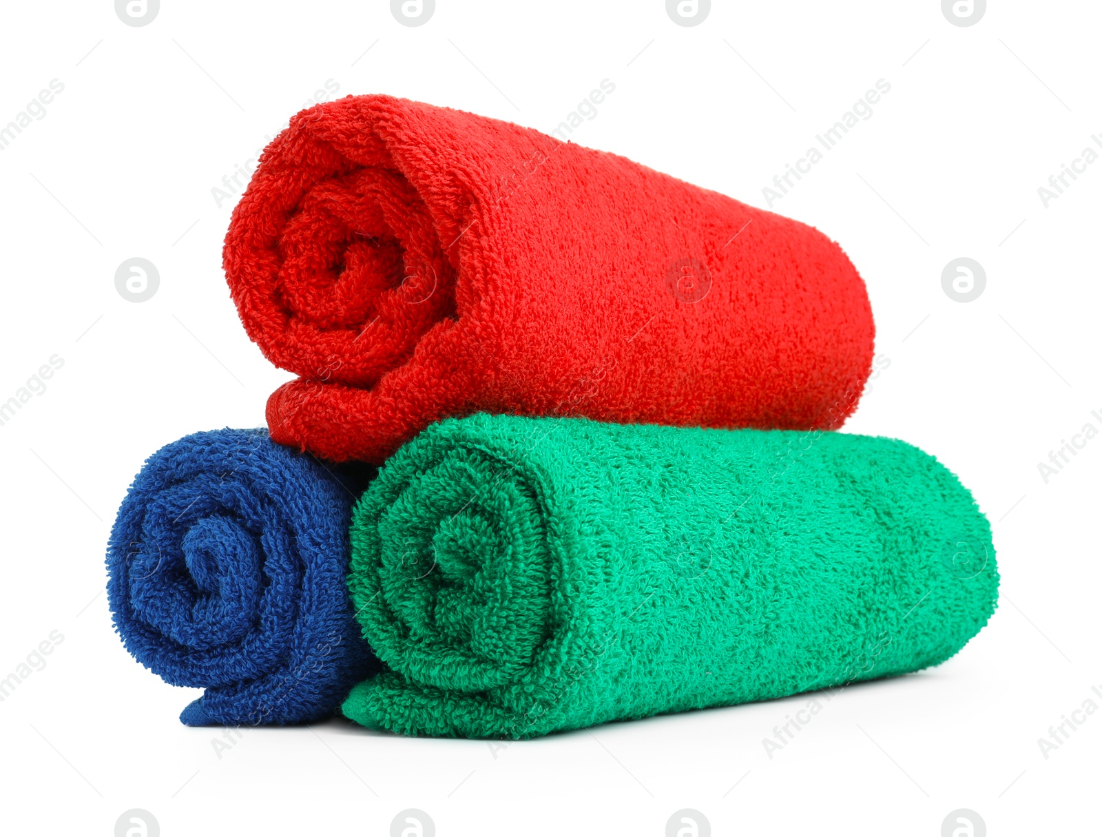 Photo of Colorful rolled terry towels isolated on white
