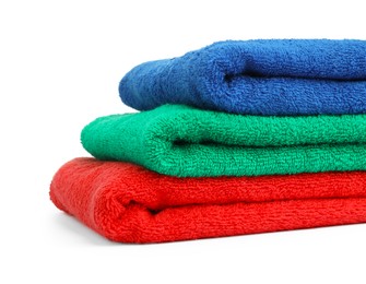 Photo of Stack of colorful terry towels isolated on white