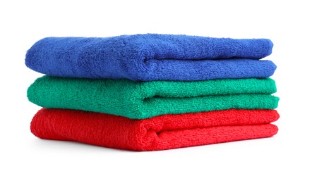Photo of Stack of colorful terry towels isolated on white