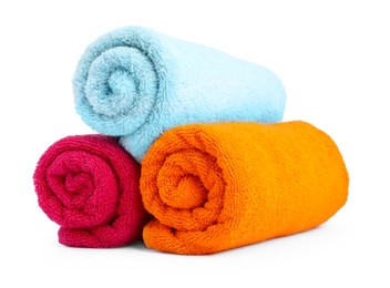 Photo of Colorful rolled terry towels isolated on white