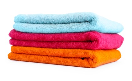 Photo of Stack of colorful terry towels isolated on white
