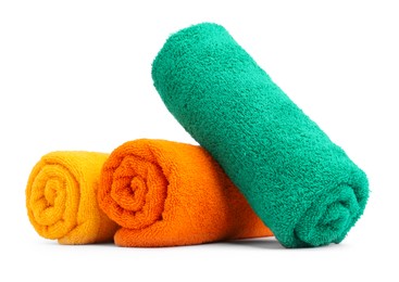 Photo of Colorful rolled terry towels isolated on white